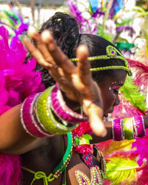 A dancer's arm extends toward camera.