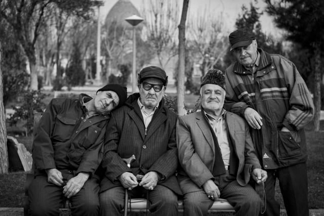 Four men pose for photo.