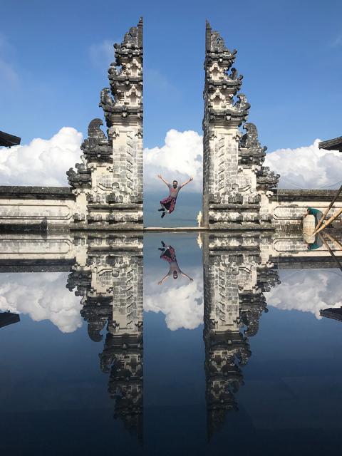 Man jumping between temple