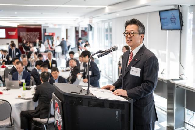 Man speaks at conference podium