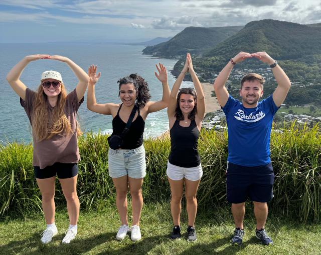 O-H-I-O standing above a bay in Australia