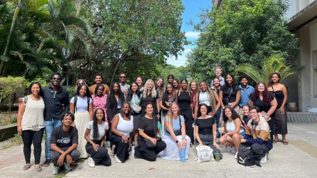 Large group outside poses for photo