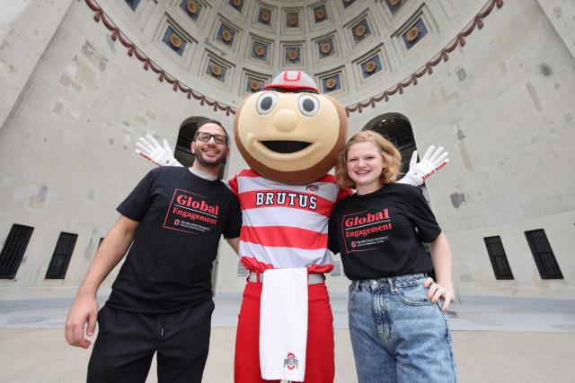 Two students pose with Brutus at the Ohio stadium