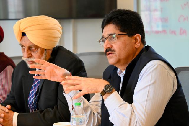 Man speaks during a meeting.