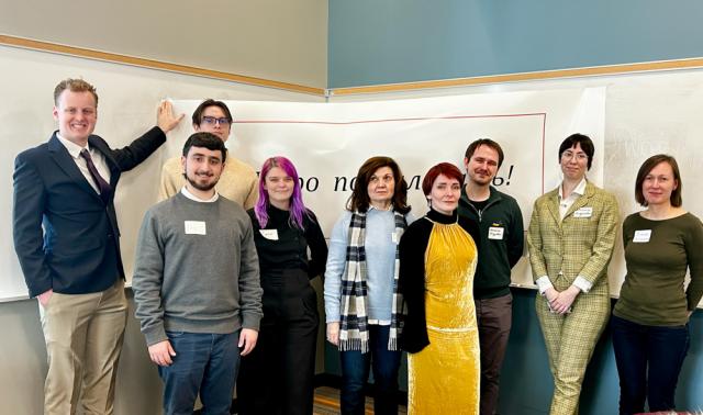 Group of student pose in a classroom