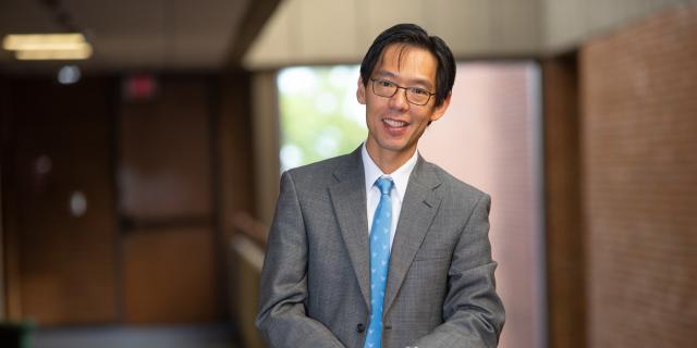 Male wearing glasses and suit