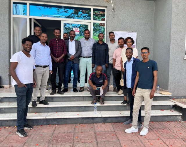 Group of healthcare professions in front of building in Ethiopia