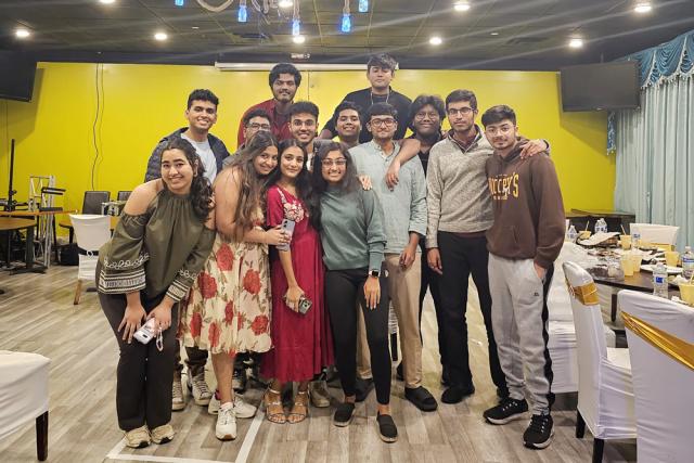 Group of students posing inside
