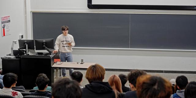 Student presenting in front of a class