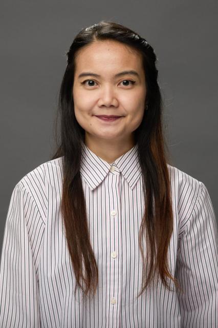 Potrait of female wearing dress shirt with long hair 