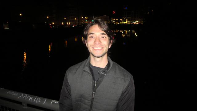 Student near dark bridge