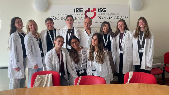 Group of students and doctors in white coats