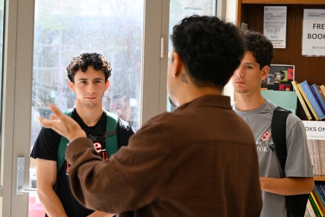 Student listening to a teacher speak.