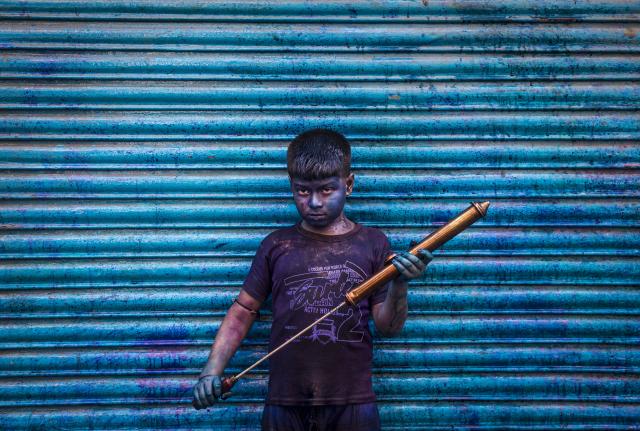 Young Boy during holi covered in blue dye