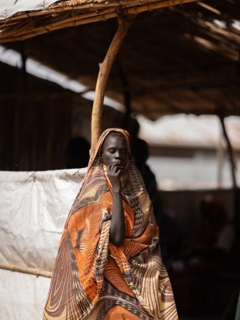 Woman draped in a cape