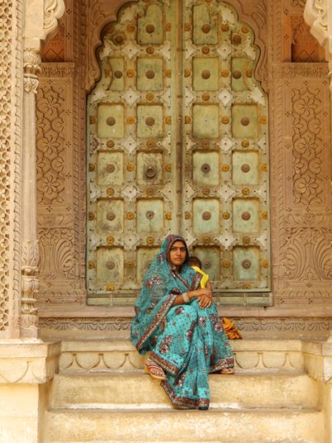 woman sitting on steps