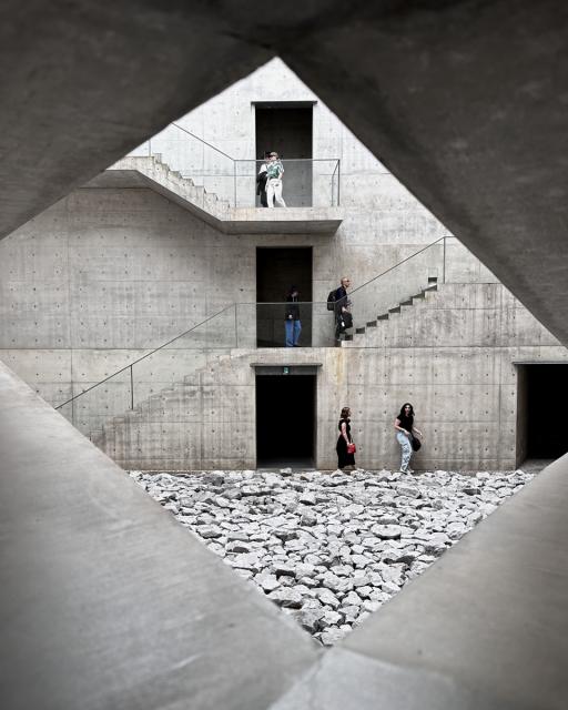 Visitors in the courtyard at Tadao Ando's Chichu Museum.