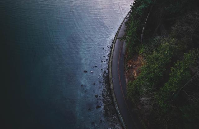 High angle view of road alongside water