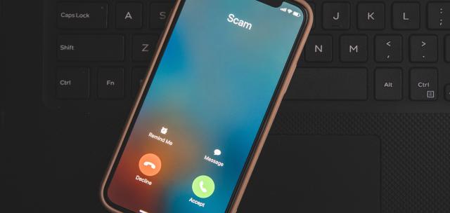 Scam Cellphone call ringing on a keyboard