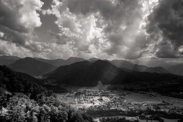 Long view down to city with mountains in background.
