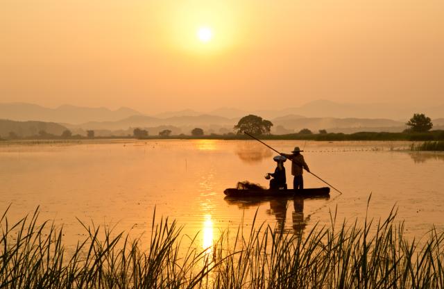 Two people on boat in body of water