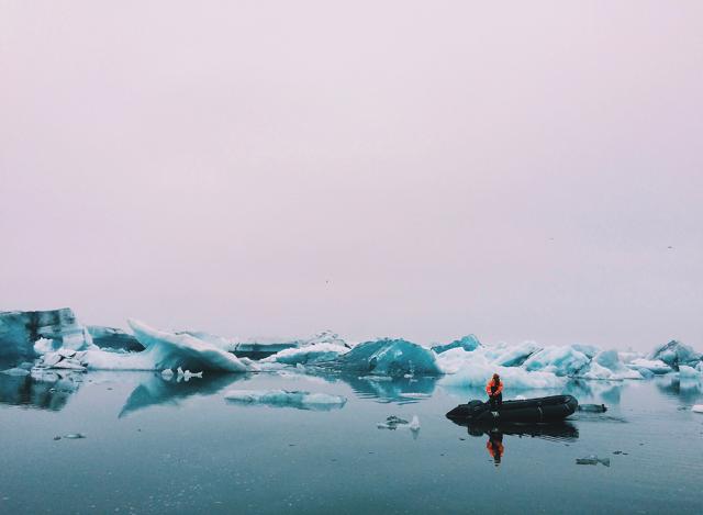 person on raft in body of water