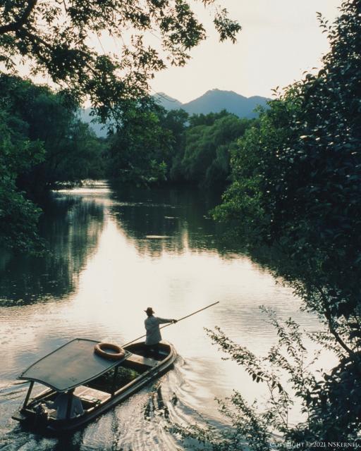 Boat heading down river