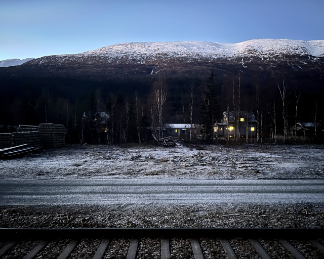 Frozen nordic town next to a railroad track