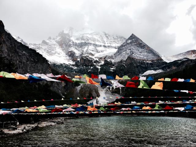 flags hung in front of mountain