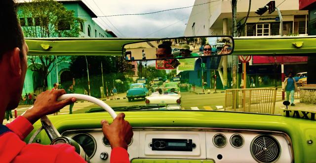 View through car windshield from back seat.