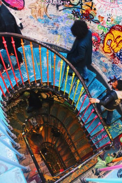 Two males walking on colorful steps