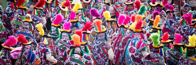 Populated crowd of people in colorful clothes