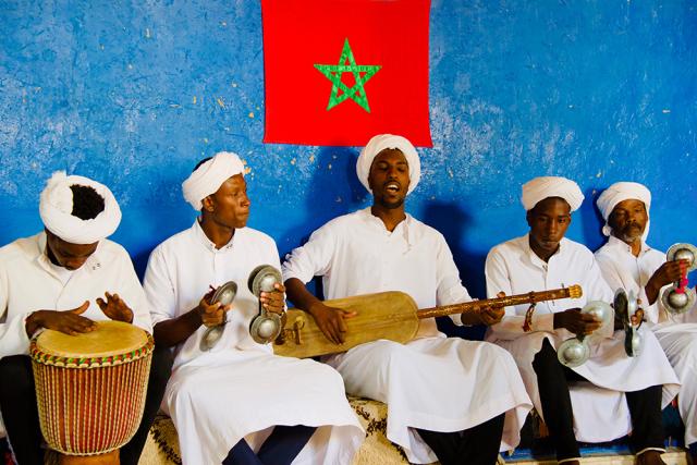 Five men playing instruments.