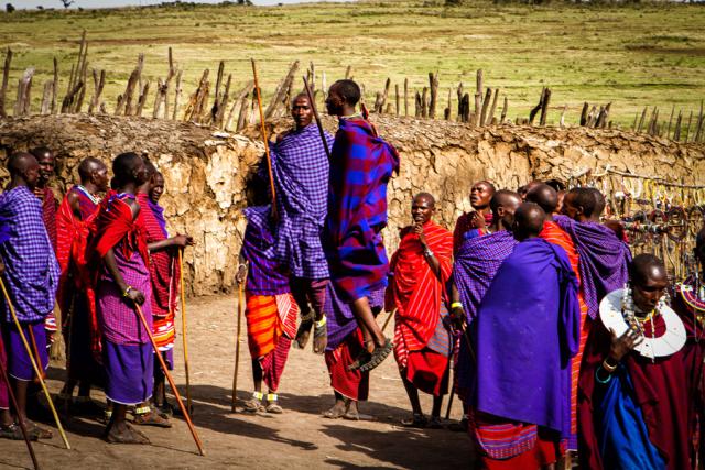 Tribe of people in bright colored clothes