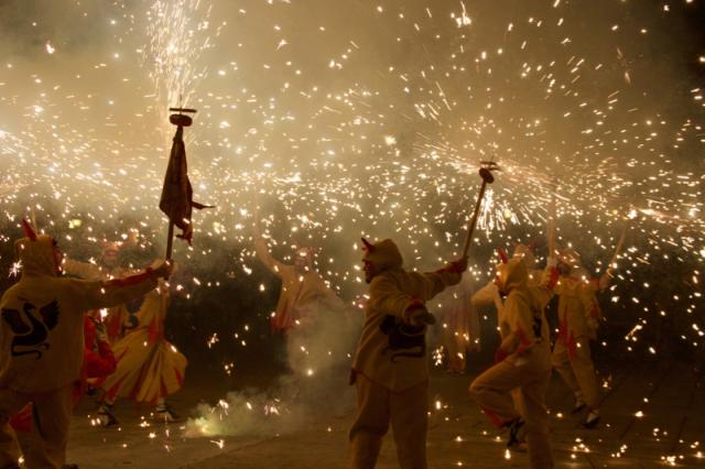 group of people with fireworks going off