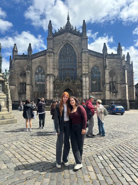 Two young women in front of an Irish church