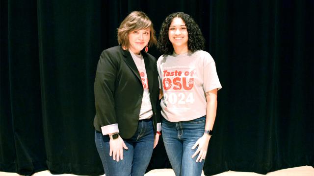 Two young people standing together at Taste of OSU 2023, one is Student Chair Shadiyah Feliciano