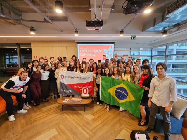 Group of students posing together in a classroom in Brazil