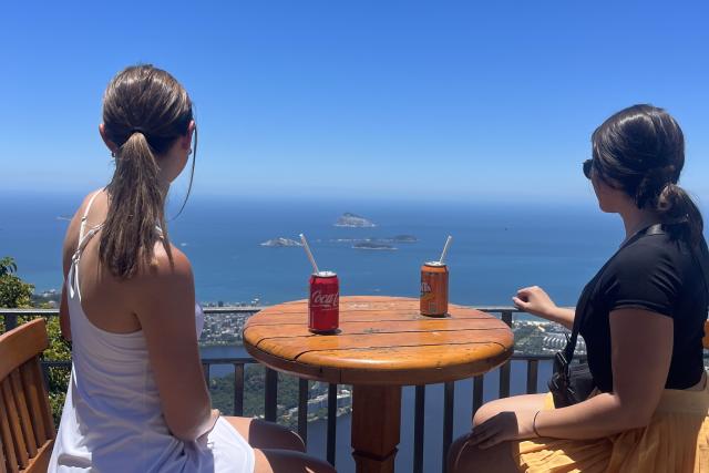 Two young women look out over Brazilian landscape