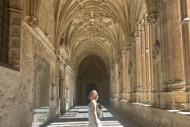 Young woman in a European hallway