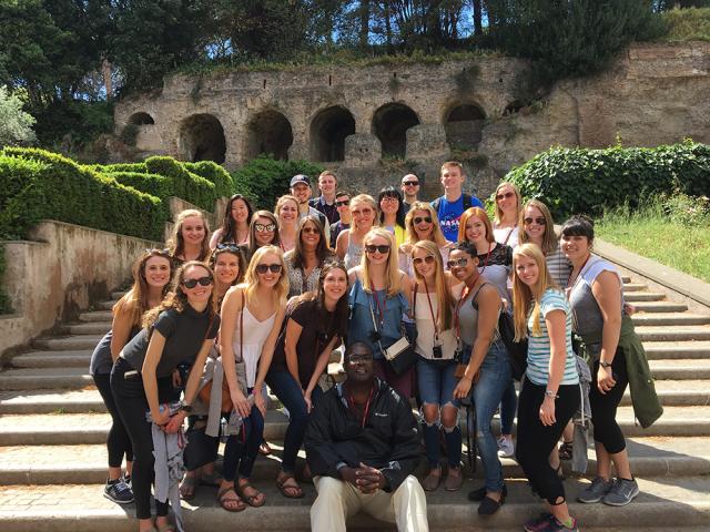 Students group on stairs.