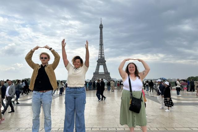 Group performs O-H-I-O with Eiffel tower