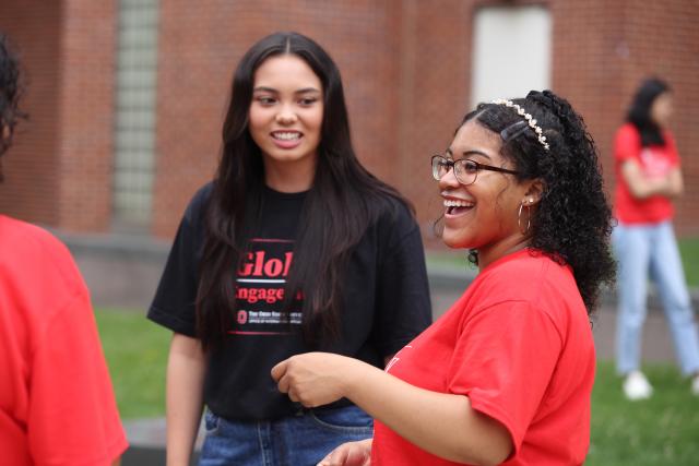 Two young people chatting with a person off camera