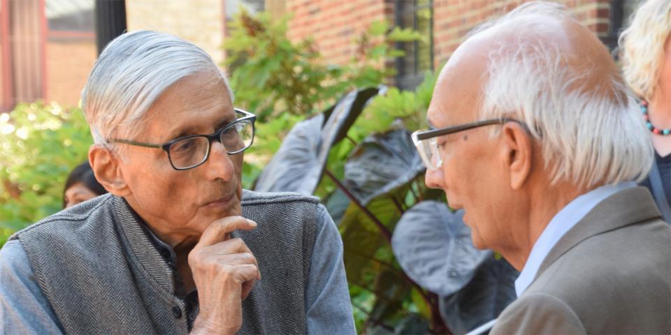 Rajmohan Gandhi chats with Rattan Lal on a sunny day