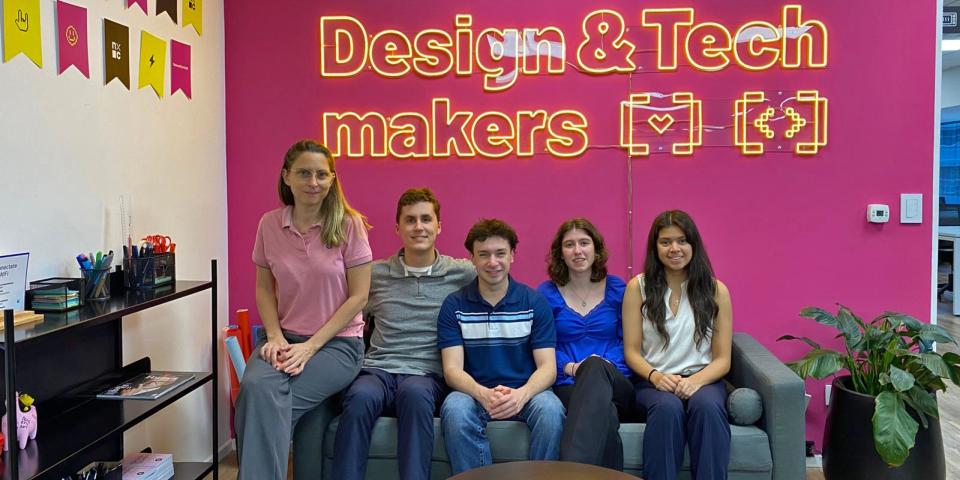 students posing in an office