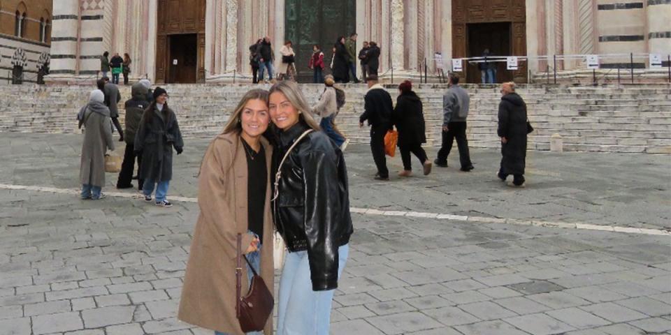 Students in front of building in Italy