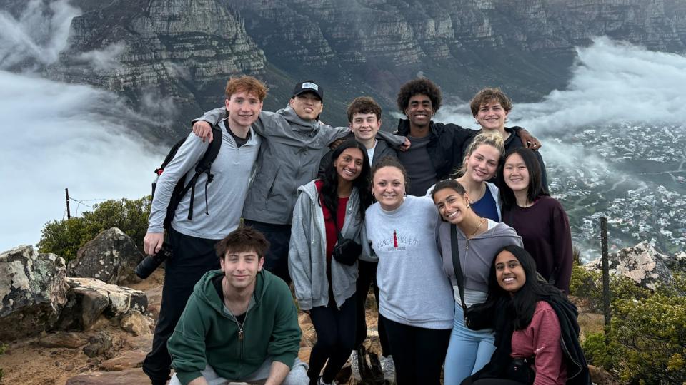 Students posing near mountain