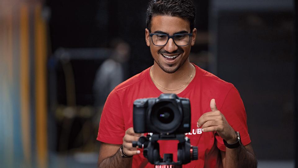 Student smiling taking a photo
