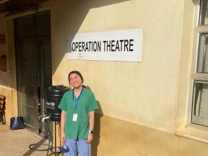 Woman standing outside an operation room in Uganda