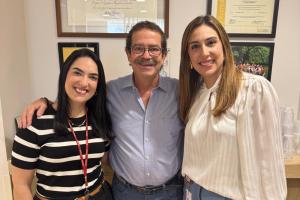 Three researchers pose for photo